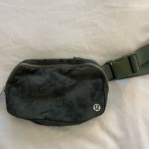 Army green tie-dye Lululemon belt bag.